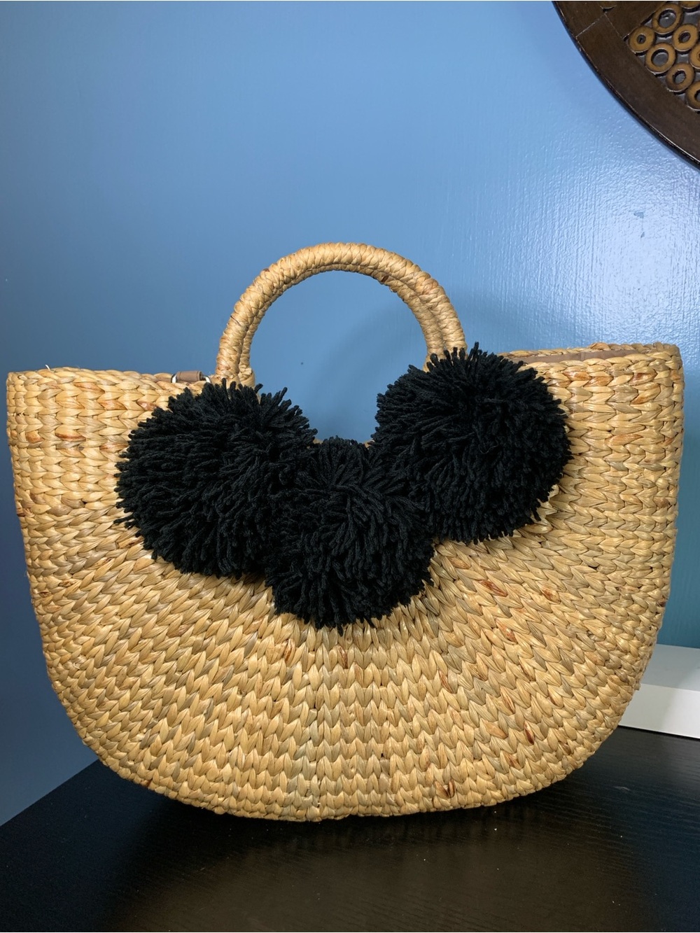 Sea & Grass Woven Straw Tote Bag in Tan with black poms
